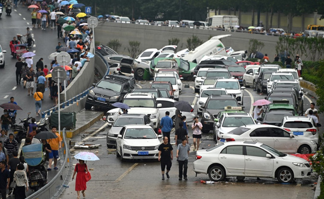 Chinese City Picks Through The Debris After Record Rain Kills 33