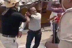 IAS Officer Thrashes Journalist In Public During UP Local Polls IAS Officer Thrashes Journalist In Public During UP Local Polls