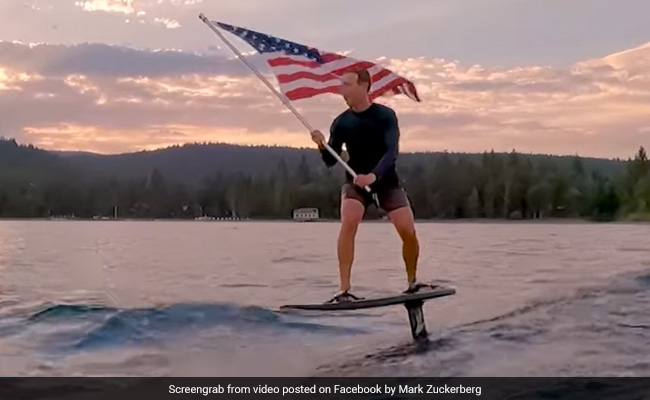 Mark Zuckerberg's Surfing Video Holding US Flag Has Internet Divided
