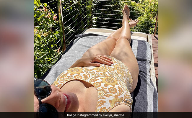 Mom-To-Be Evelyn Sharma Poses In A Yellow Swimsuit With Her Baby Bump On Display