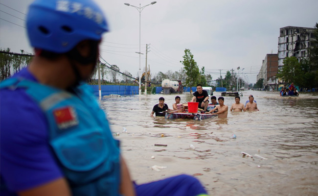 China Evacuates Thousands As Storms Spread North, Flood Deaths Rise To 33