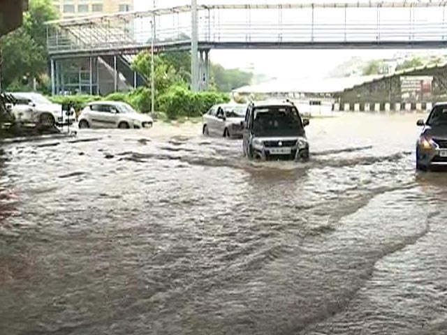 People Wade Through Submerged Roads After Heavy Rain In Gurgaon
