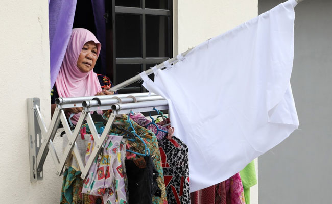 As COVID-19 Lockdown Bites, Malaysians Hoist White Flags In Plea For Help