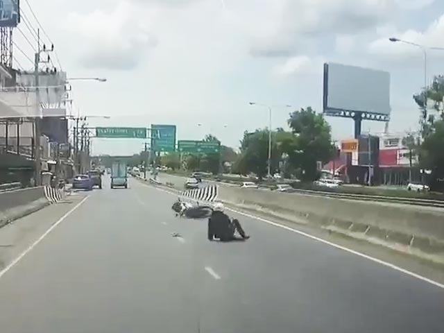 Distracted Rider Barrels Straight Into Road Divider