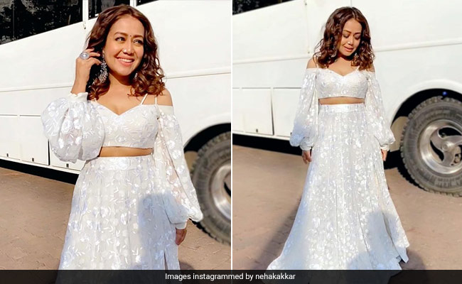 Neha Kakkar Gives Us Playful Ethnic Vibes In A White Off-Shoulder Blouse And Flowing Skirt