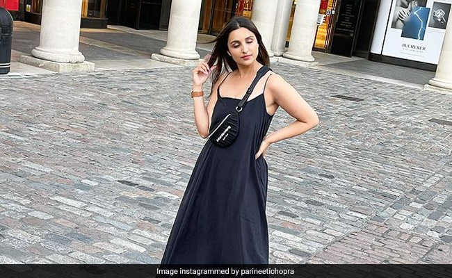 Parineeti Chopra Is Ready For Photos In Her Black Dress And Rs 85K Alexander Wang Belt Bag