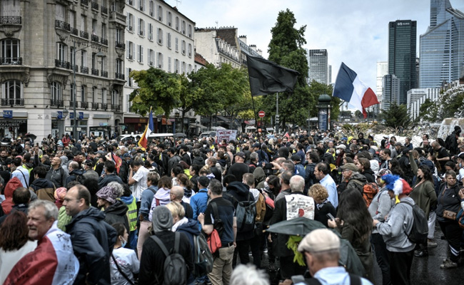 France Implements President Macron's Covid Health Pass Despite Protests