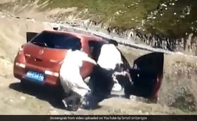 Terrifying Video Shows Family Jumping Out Of Car As It Rolls Down Cliff