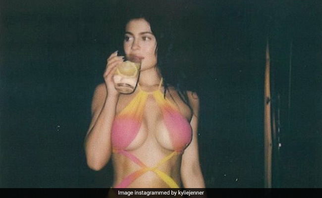 Kylie Jenner Makes A Splash In An Orange And Pink Ombre Cutout Swimsuit