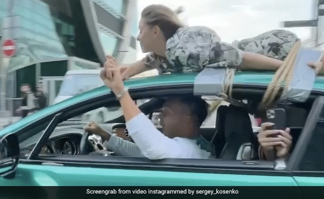 Watch: Man Drives With Girlfriend Tied To Roof In Bizarre 'Trust Test'