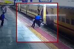 Woman Slips Trying To Board Moving Train, Passengers Rescue Her Woman Slips Trying To Board Moving Train, Passengers Rescue Her