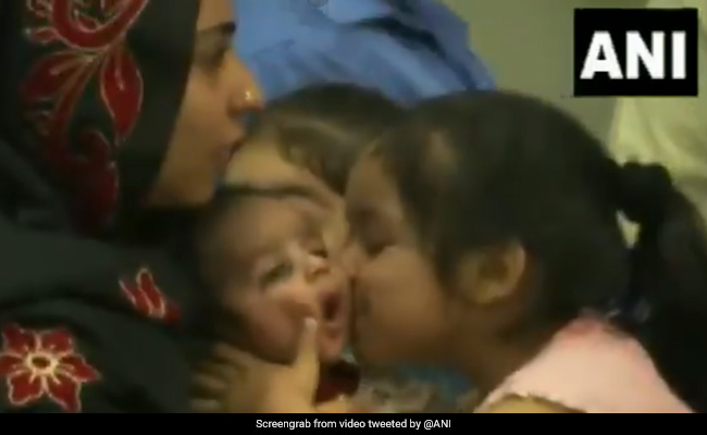 Heartwarming Video Of Girl Kissing Baby After Reaching India From Kabul