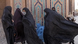 'No Right To Breathe Freely': Afghan Women Detained In Clothing Crackdown