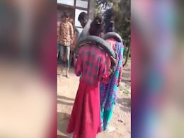 On Camera, Couple Forced To Dance With Tyres Around Necks For Eloping On Camera, Couple Forced To Dance With Tyres Around Necks For Eloping