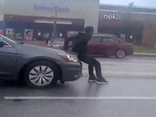 Man Tries To Stop Car, Gets Dragged Around For Several Minutes