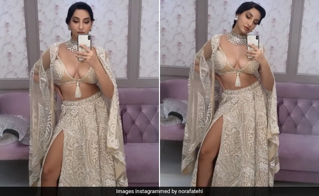 Nora Fatehi Gives Her <i>Chikankari Lehenga</i> A Daring New Twist With A Thigh High Slit On The Side