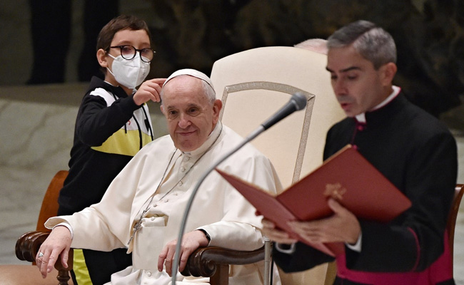 Boy Unexpectedly Walks Onto Stage, Says Hello To Pope, Asks For His Cap