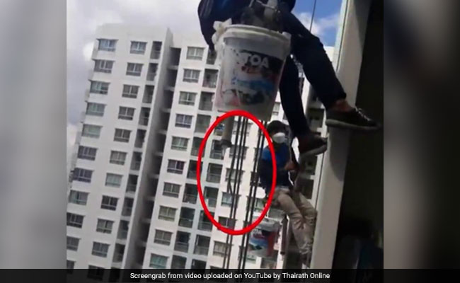 Two Workers Left Dangling From 26th Floor After Woman Cuts Rope