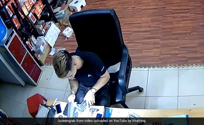 Watch: Mobile Phone Bursts Into Flames As Worker Is Repairing It