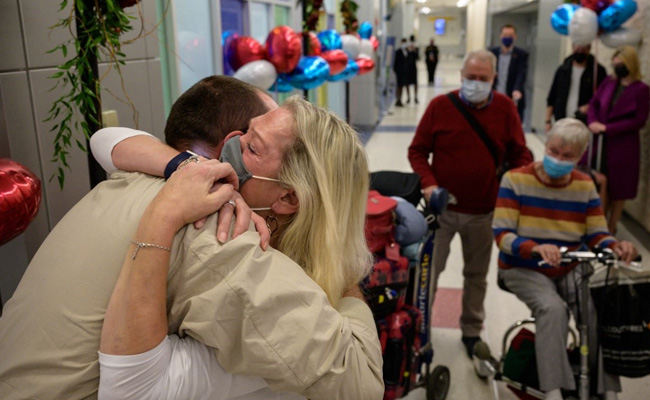Teary-Eyed Family Reunions At New York Airport As US Reopens Borders