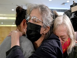 Families Reunite In Sydney Airport As Australia Lifts 600-Day Travel Ban Families Reunite In Sydney Airport As Australia Lifts 600-Day Travel Ban