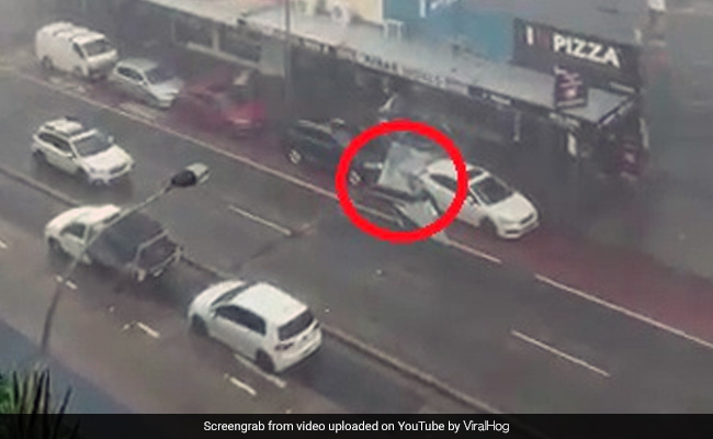 Watch: Storm Blows Off Metal Roof. Narrow Escape For Passing Car