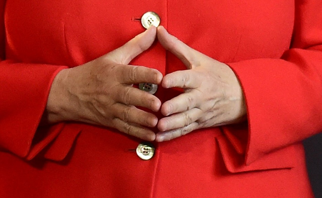 "Love Of Symmetry": How Angela Merkel's Rhombus Hand Gesture Became A Brand