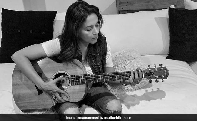 Madhuri Dixit Grooves With Her "Rock on" Guitar- See Pic