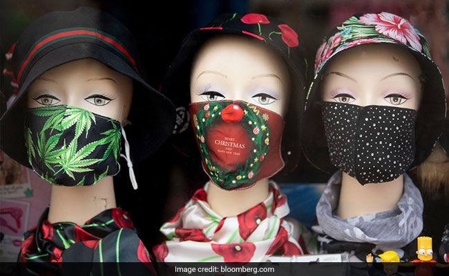 Wear Two Masks To Keep Omicron At Bay, These Experts Say