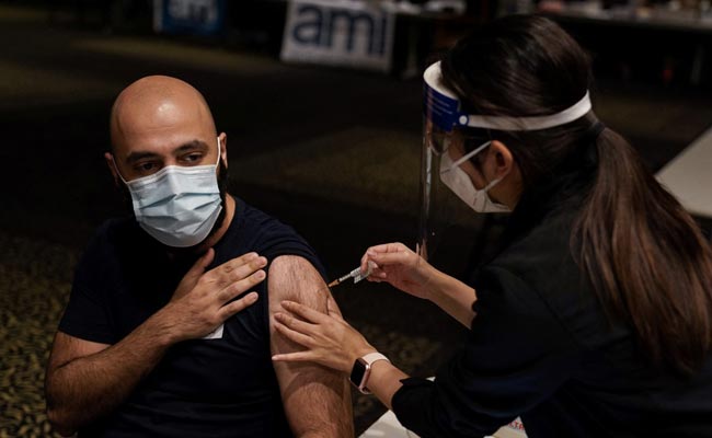 Australia To Cut Booster Intervals As Omicron Pushes Cases To Records