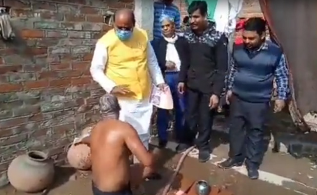 Watch: Campaigning BJP MLA Asks Man, Bathing - "Do You Have Ration Card?"