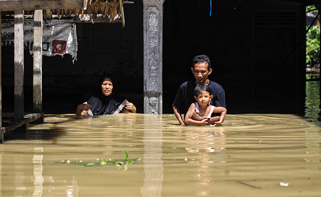 24,000 Evacuated As Water Levels Surge After Floods In Indonesia