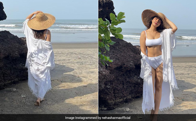 The Best Of Neha Sharma's "Postcards From Goa" Includes Her Stylish White Swimsuit At The Beach