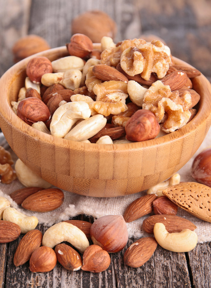 Nuts may be a better alternative to unhealthy snacks you may be craving during periods
