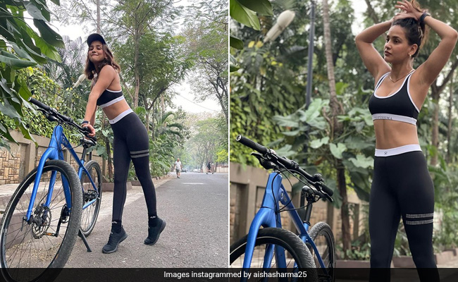Aisha Sharma In A Black Top And Tights Cycles Down The Stylish Path In Her Sporty Best