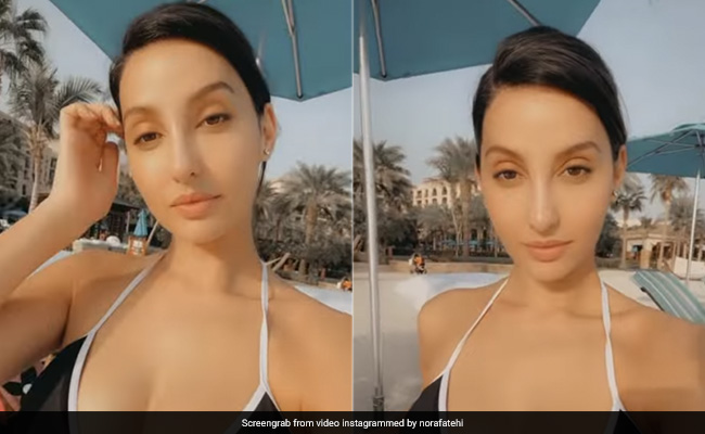 Nora Fatehi Spends Balmy Days By The Beach In A Chic Black And White Swimwear