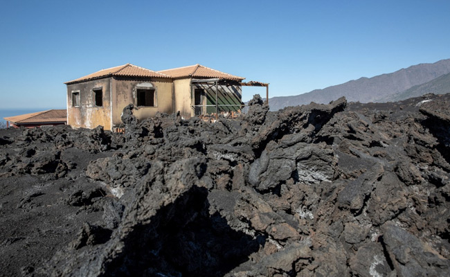 Spain Residents Return To Ash Filled Homes Months After Volcano Eruption