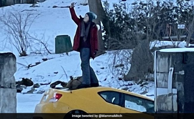 Woman Takes Selfie On Top Of Sinking Car As People Rush To Rescue Her