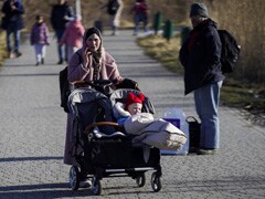 Leaving Behind Possessions And Pets, Ukrainians Flee To Poland