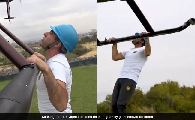 शख्स ने हेलिकॉप्टर से लटककर किया खतरनाक स्टंट, 1 मिनट तक हवा में किए Pull-Ups, बनाया रिकॉर्ड