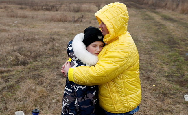 Woman Takes Stranger's Children To Safety At Ukraine Border