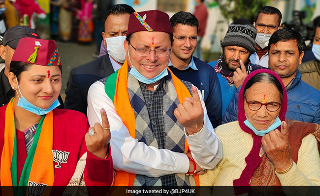 Voting On, Uttarakhand Chief Minister, Wife Flaunt BJP Symbol At Booths