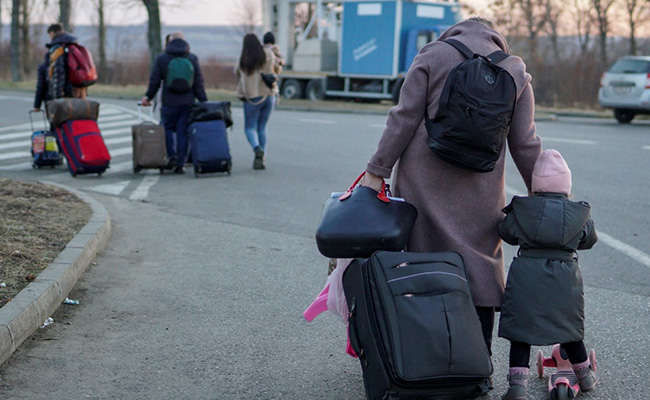 Thousands Cross Ukraine Borders, Men Told To Stay And Fight