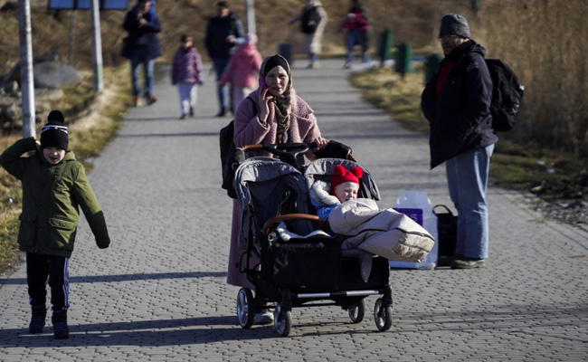 Leaving Behind Possessions And Pets, Ukrainians Flee To Poland