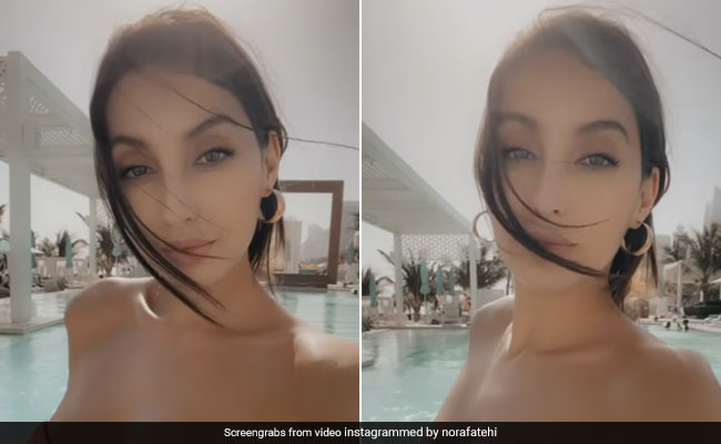 One Can't Miss Nora Fatehi Enjoy A Dip In The Pool Thanks To Her Peach Swimsuit
