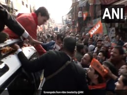 Watch: Priyanka Gandhi Stops Roadshow To Hand Manifesto To BJP Workers Watch: Priyanka Gandhi Stops Roadshow To Hand Manifesto To BJP Workers