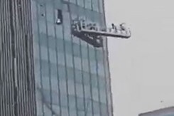 Terrifying Moment Window Cleaners' Cradle Slams Into Skyscraper Terrifying Moment Window Cleaners' Cradle Slams Into Skyscraper
