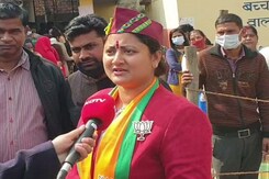 Voting On, Uttarakhand Chief Minister, Wife Flaunt BJP Symbol At Booths Voting On, Uttarakhand Chief Minister, Wife Flaunt BJP Symbol At Booths