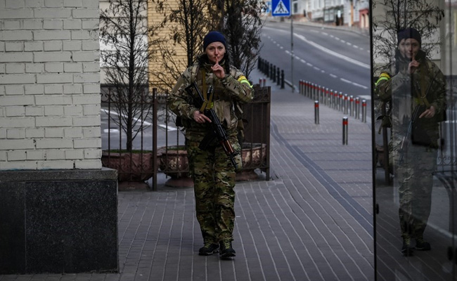 Guns, Blasts And Smiles In Ukraine's Kyiv Under Military Curfew