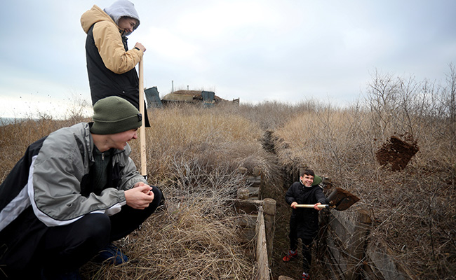 "Our Responsibility": Ukraine Teens Dig Trenches Facing Russia Threat